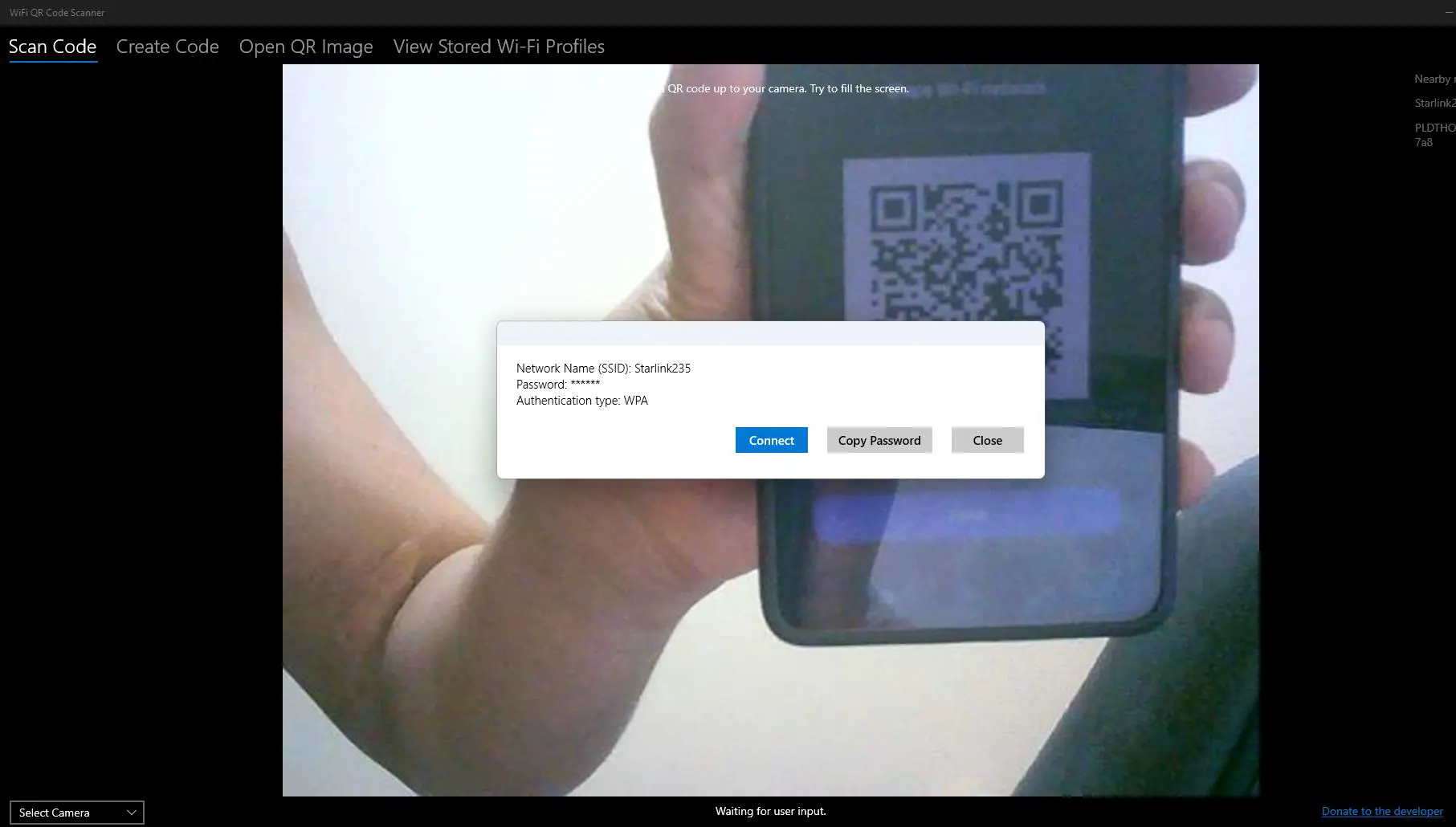 Click on ‘Scan Code’ tab if not already selected and Position the Wi-Fi QR code within the camera