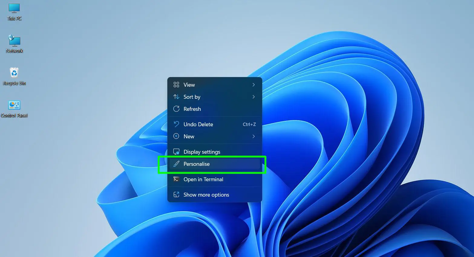 Right-click anywhere on the desktop background and Select ‘Personalize’