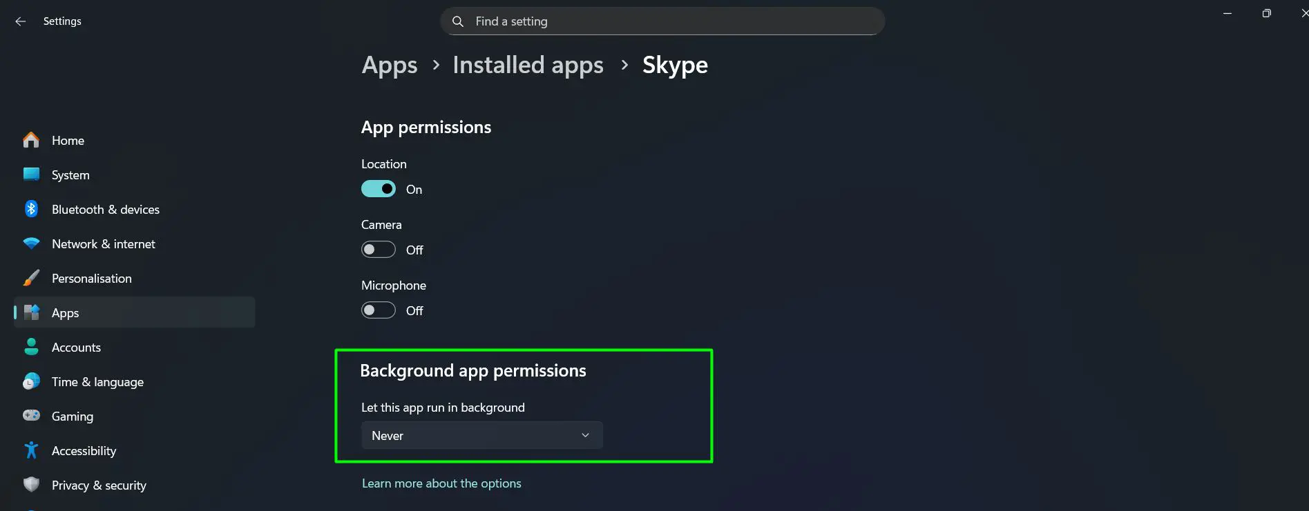 Click the dropdown under Let this app run in background and Select Never for apps that don’t need background access