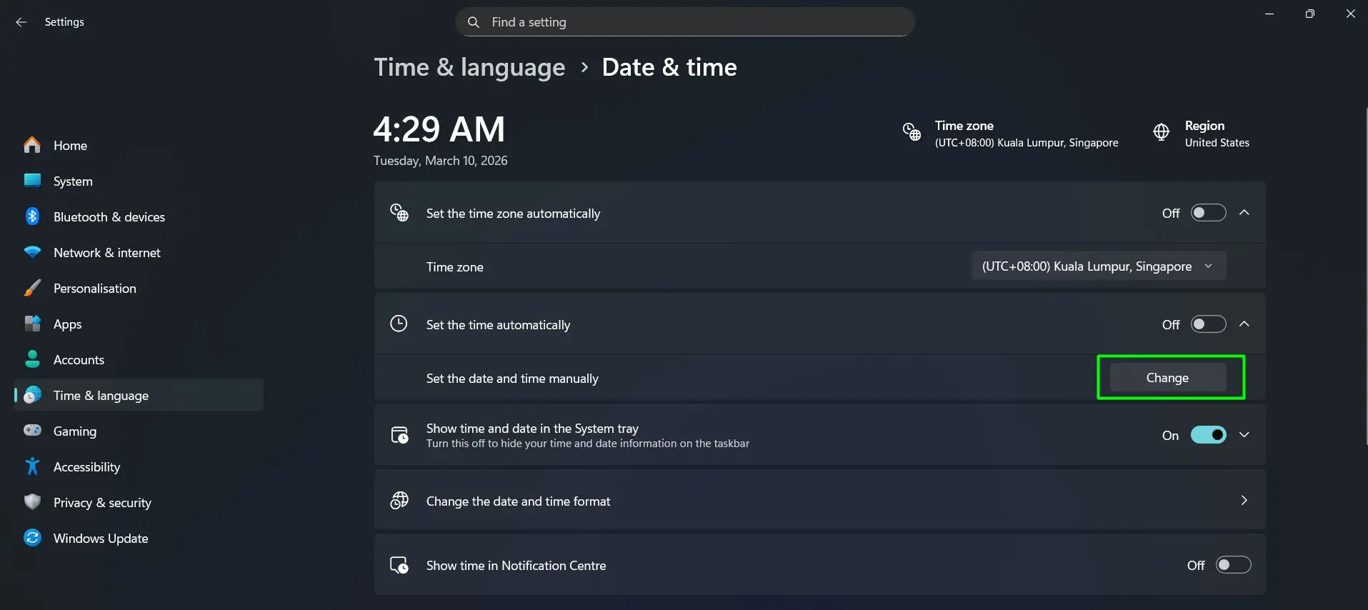 Under the section labeled ‘Set the date and time manually’, click the Change button